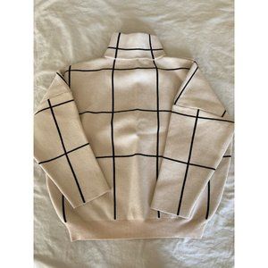 Cream turtleneck sweatshirt